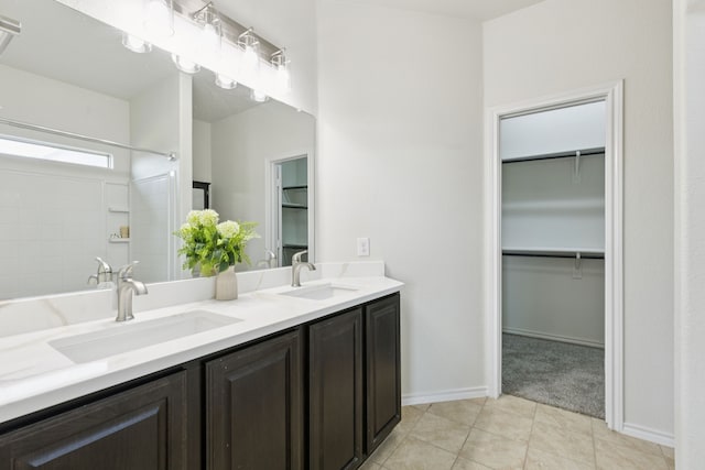 313 Pimlico Way, Ponder, TX 76259 - full bathroom featuring double vanity, a walk in closet, tile patterned floors, and a shower