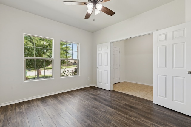 313 Pimlico Way, Ponder, TX 76259 - unfurnished bedroom featuring dark wood-type flooring and ceiling fan