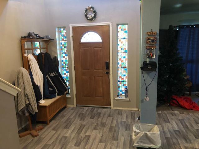 2542 Dove Crossing Dr, New Braunfels, TX 78130 - foyer entrance featuring wood finished floors and baseboards
