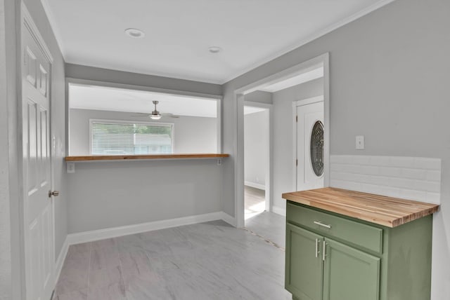 315 Ratcliff, Shreveport, LA 71104 - kitchen featuring green cabinets, wooden counters, light marble finish flooring, and ceiling fan