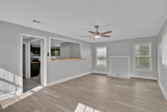 315 Ratcliff, Shreveport, LA 71104 - unfurnished living room featuring ceiling fan and wood finished floors