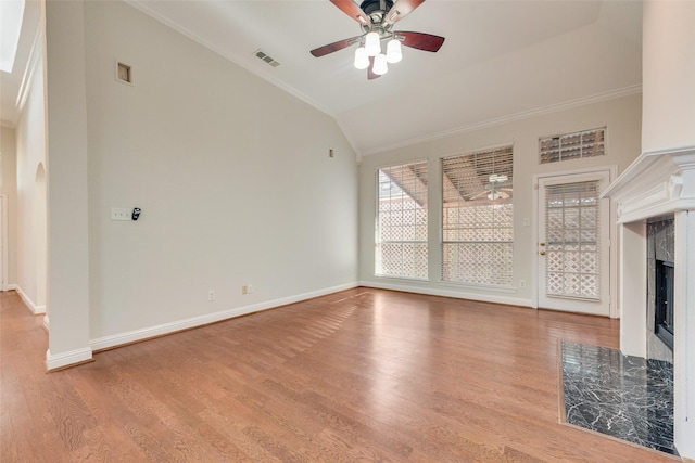 3032 Silver Springs Ln, Plano, TX 75025 - unfurnished living room featuring lofted ceiling, ornamental molding, a fireplace, ceiling fan, and light wood-style floors