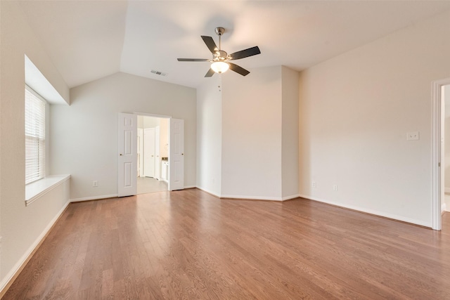 3032 Silver Springs Ln, Plano, TX 75025 - spare room with wood finished floors, a ceiling fan, and vaulted ceiling