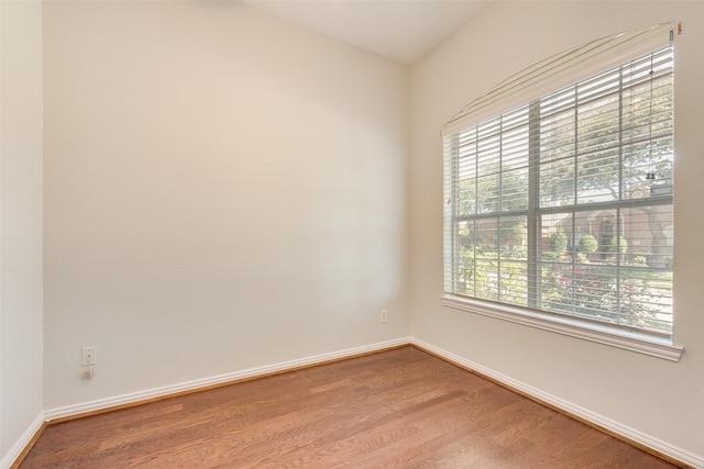 3032 Silver Springs Ln, Plano, TX 75025 - empty room with plenty of natural light and wood finished floors