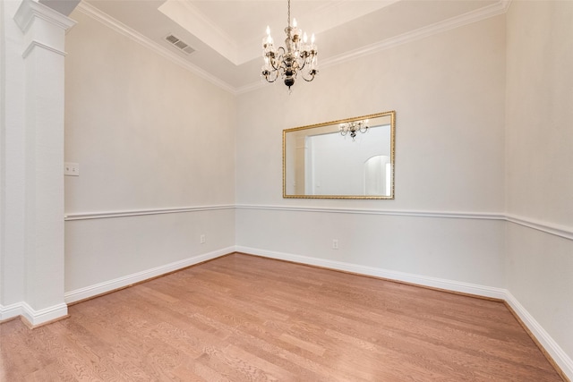 3032 Silver Springs Ln, Plano, TX 75025 - spare room with a chandelier, wood finished floors, a raised ceiling, and ornamental molding
