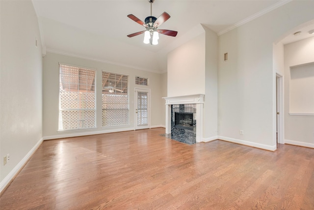 3032 Silver Springs Ln, Plano, TX 75025 - unfurnished living room with wood finished floors, a ceiling fan, a premium fireplace, and ornamental molding