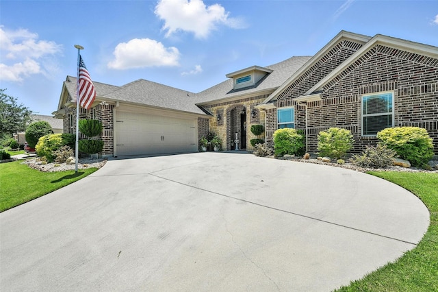 6513 Deer Horn Dr, Fort Worth, TX 76179 - french provincial home featuring brick siding, a garage, concrete driveway, roof with shingles, and a front yard