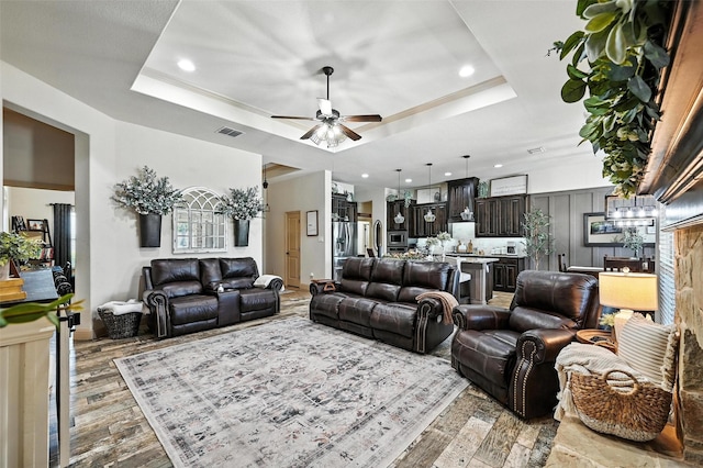 6513 Deer Horn Dr, Fort Worth, TX 76179 - living room featuring a tray ceiling, hardwood / wood-style floors, ceiling fan, and recessed lighting