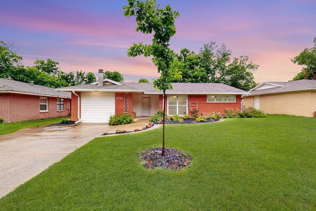 3733 Tam O Shanter Dr, Mesquite, TX 75150 - ranch-style house with brick siding, concrete driveway, a lawn, and a chimney