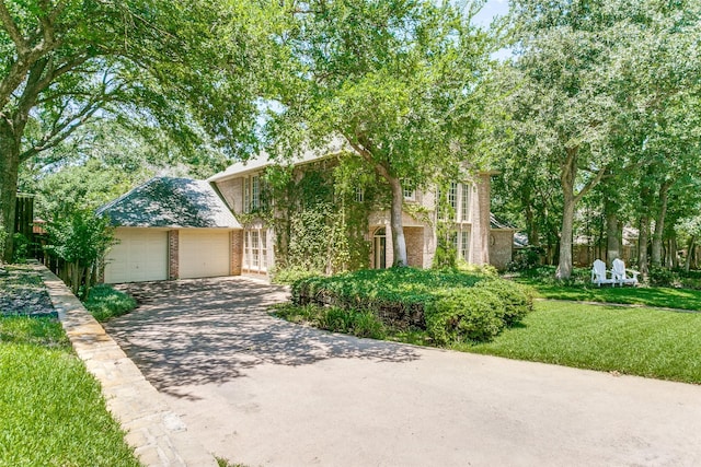 3816 Shady Meadow Dr, Grapevine, TX 76051 - view of front of property with driveway, brick siding, a front yard, and a garage