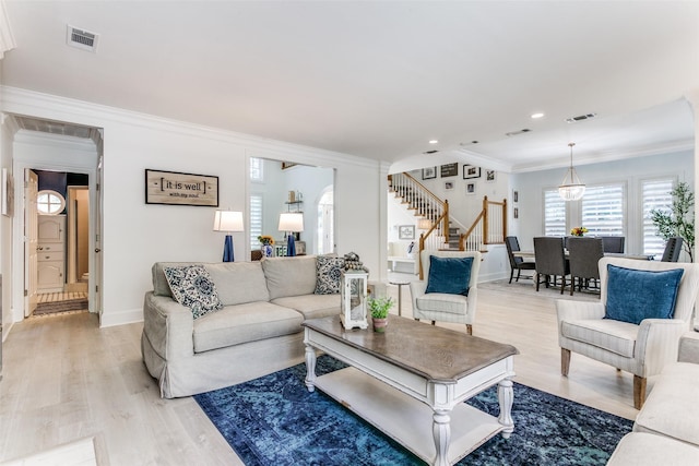 3816 Shady Meadow Dr, Grapevine, TX 76051 - living area with crown molding, stairway, light wood-style floors, recessed lighting, and arched walkways
