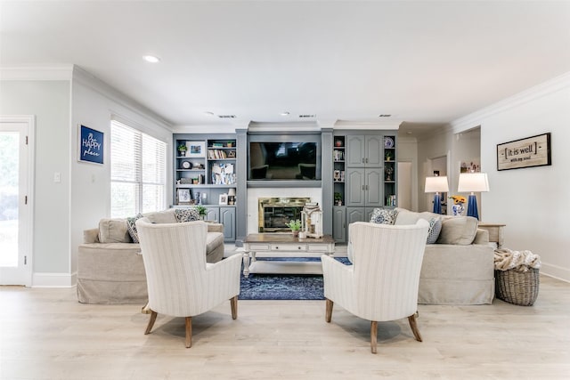 3816 Shady Meadow Dr, Grapevine, TX 76051 - living area featuring crown molding, light wood-type flooring, healthy amount of natural light, recessed lighting, and a glass covered fireplace