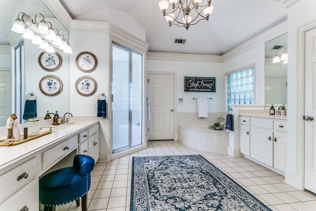 3816 Shady Meadow Dr, Grapevine, TX 76051 - bathroom featuring lofted ceiling, a bath, two vanities, tile patterned floors, and a chandelier