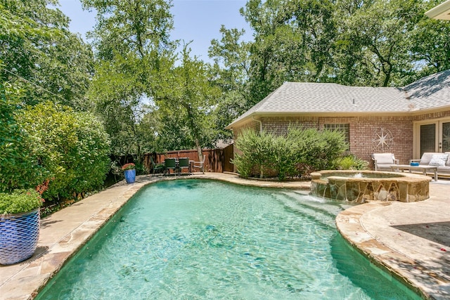 3816 Shady Meadow Dr, Grapevine, TX 76051 - view of swimming pool featuring a fenced backyard, a pool with connected hot tub, and a patio area