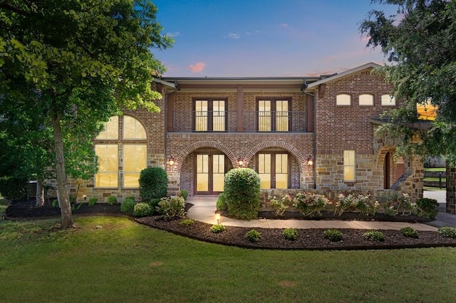 6901 Hickory Hill Cir, Argyle, TX 76226 - view of front of house with a balcony, a front lawn, brick siding, and stone siding