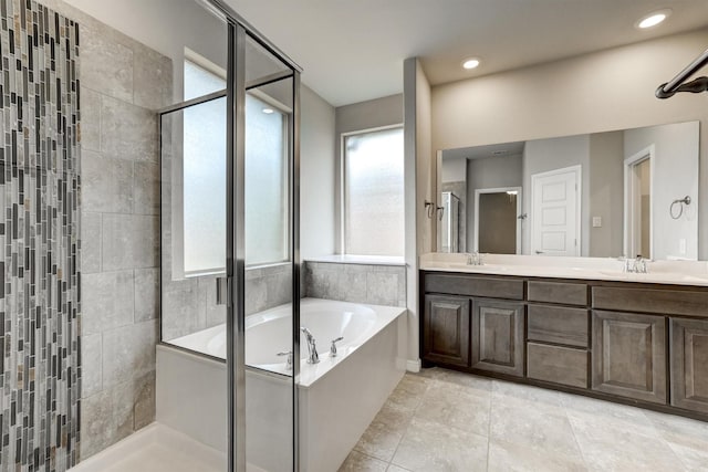 601 Redding Dr, Saginaw, TX 76131 - full bathroom with a shower stall, a garden tub, double vanity, recessed lighting, and tile patterned flooring