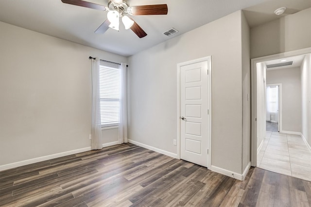 601 Redding Dr, Saginaw, TX 76131 - unfurnished bedroom with wood finished floors and a ceiling fan