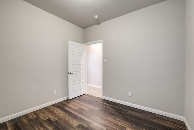 601 Redding Dr, Saginaw, TX 76131 - empty room with dark wood-type flooring and baseboards
