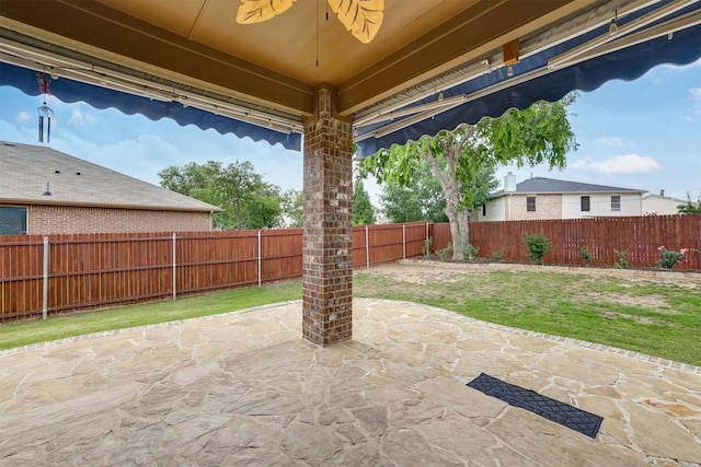 601 Redding Dr, Saginaw, TX 76131 - fenced backyard with a patio area and ceiling fan