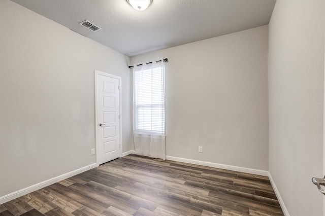 601 Redding Dr, Saginaw, TX 76131 - unfurnished room featuring dark wood finished floors and baseboards