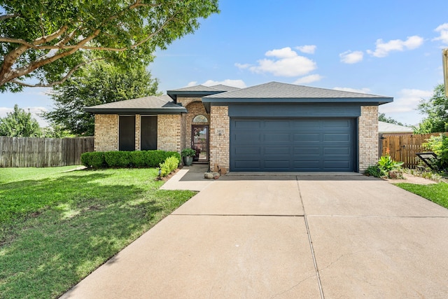 3413 Westfork Ranch Rd, Fort Worth, TX 76262 - view of front facade with brick siding, driveway, an attached garage, and a shingled roof