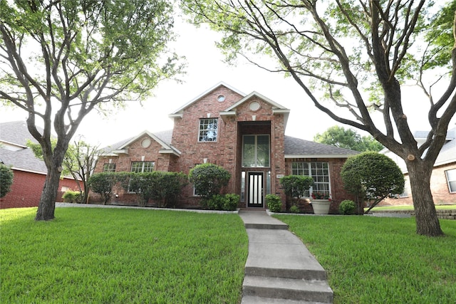 3620 Flintstone Dr, Plano, TX 75074 - traditional-style home featuring brick siding and a front lawn