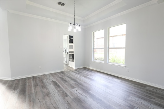 3620 Flintstone Dr, Plano, TX 75074 - spare room featuring a raised ceiling, wood finished floors, crown molding, and a chandelier