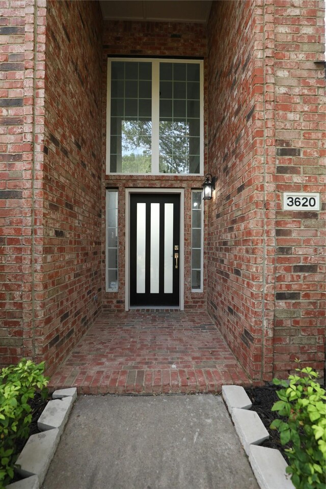 3620 Flintstone Dr, Plano, TX 75074 - view of exterior entry featuring brick siding