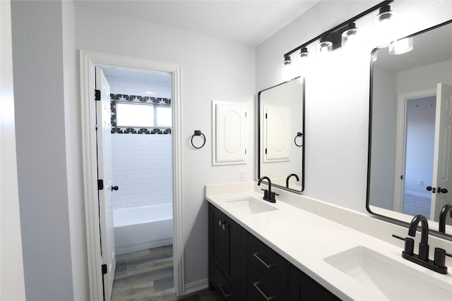 3620 Flintstone Dr, Plano, TX 75074 - full bath featuring double vanity, wood finished floors, and  shower combination
