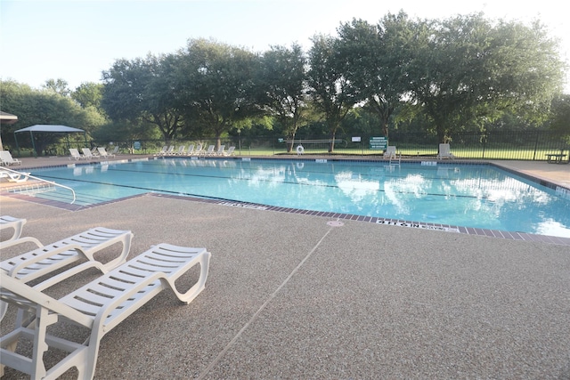 3620 Flintstone Dr, Plano, TX 75074 - community pool featuring a patio area and view of scattered trees