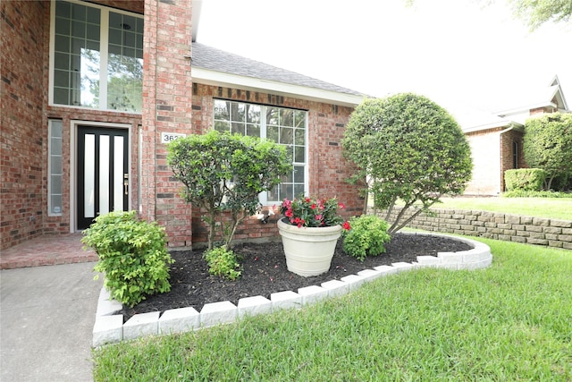 3620 Flintstone Dr, Plano, TX 75074 - entrance to property with brick siding, roof with shingles, and a lawn
