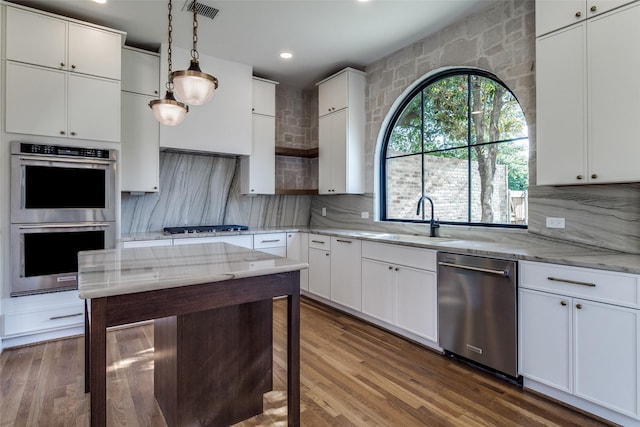 9701 Faircrest Dr, Dallas, TX 75238 - kitchen with stainless steel appliances, white cabinets, tasteful backsplash, recessed lighting, and light stone countertops