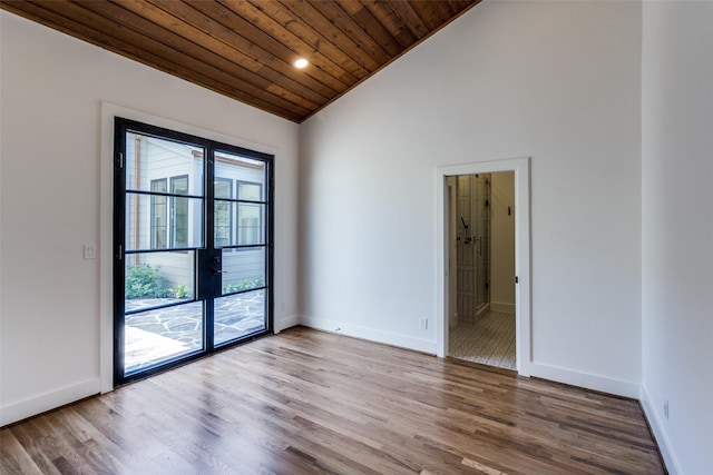 9701 Faircrest Dr, Dallas, TX 75238 - unfurnished room with vaulted ceiling, wood ceiling, wood finished floors, and french doors