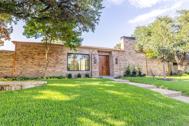 9701 Faircrest Dr, Dallas, TX 75238 - view of front of house with a front lawn, a chimney, and brick siding