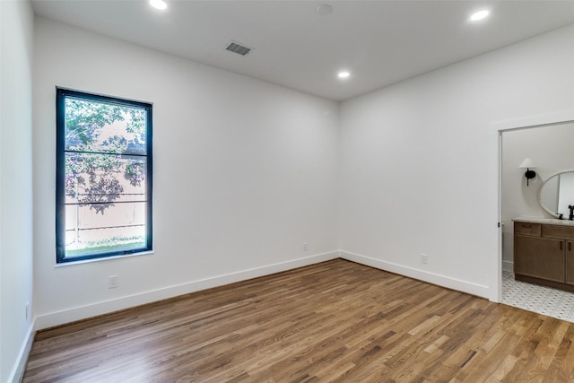 9701 Faircrest Dr, Dallas, TX 75238 - spare room featuring light wood-type flooring and recessed lighting