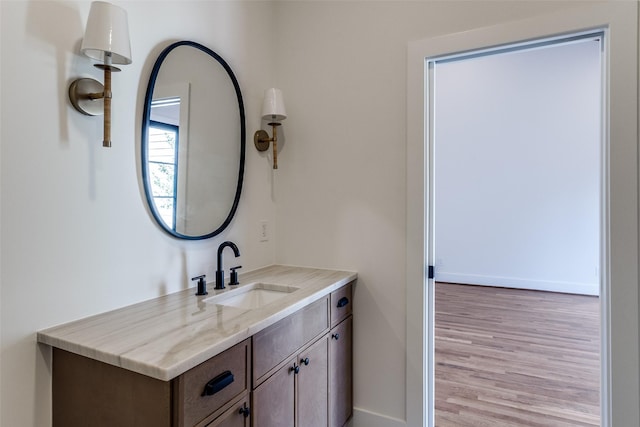 9701 Faircrest Dr, Dallas, TX 75238 - bathroom with wood finished floors and vanity