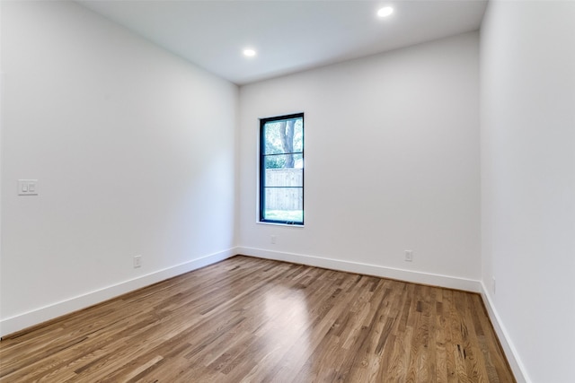 9701 Faircrest Dr, Dallas, TX 75238 - unfurnished room featuring wood finished floors and recessed lighting