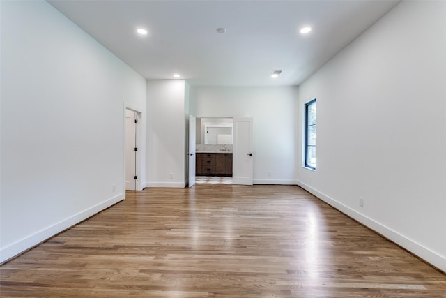 9701 Faircrest Dr, Dallas, TX 75238 - unfurnished living room featuring light wood-type flooring and recessed lighting