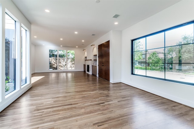 9701 Faircrest Dr, Dallas, TX 75238 - unfurnished living room with recessed lighting and light wood-style flooring