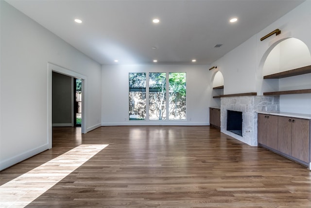 9701 Faircrest Dr, Dallas, TX 75238 - unfurnished living room featuring recessed lighting, a fireplace, and wood finished floors