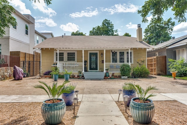 1320 Madeline Pl, Fort Worth, TX 76107 - bungalow featuring covered porch and a chimney