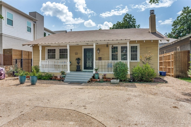 1320 Madeline Pl, Fort Worth, TX 76107 - bungalow featuring covered porch and a chimney