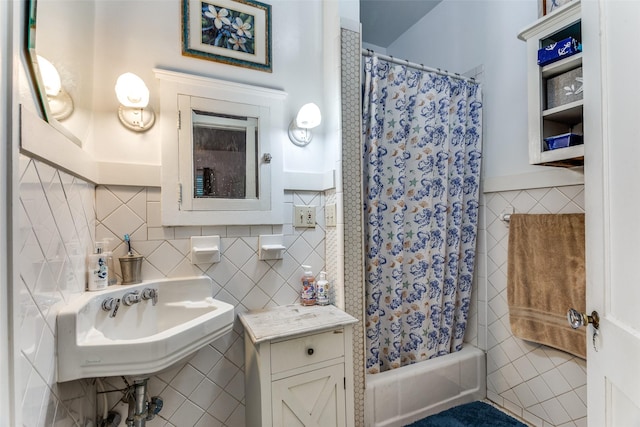 1320 Madeline Pl, Fort Worth, TX 76107 - bathroom with tile walls, shower / bath combination with curtain, and decorative backsplash