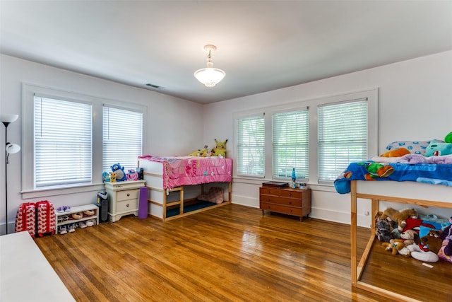 1320 Madeline Pl, Fort Worth, TX 76107 - bedroom featuring multiple windows and wood finished floors