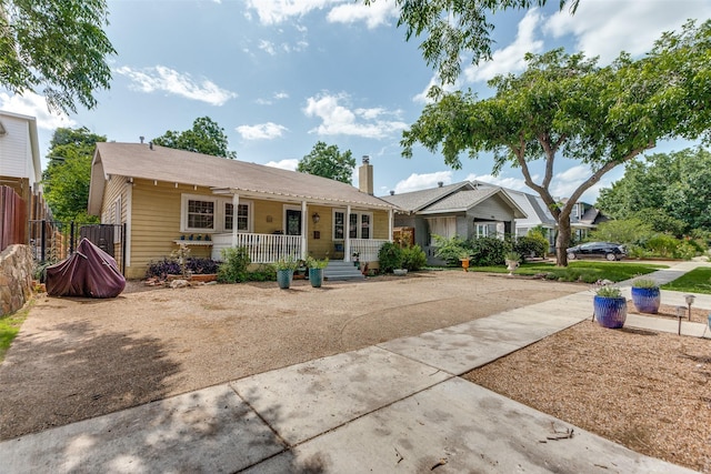 1320 Madeline Pl, Fort Worth, TX 76107 - view of front of house with covered porch and a chimney
