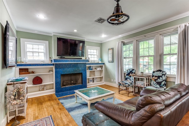 1320 Madeline Pl, Fort Worth, TX 76107 - living room featuring ornamental molding, wood finished floors, a fireplace with flush hearth, and recessed lighting