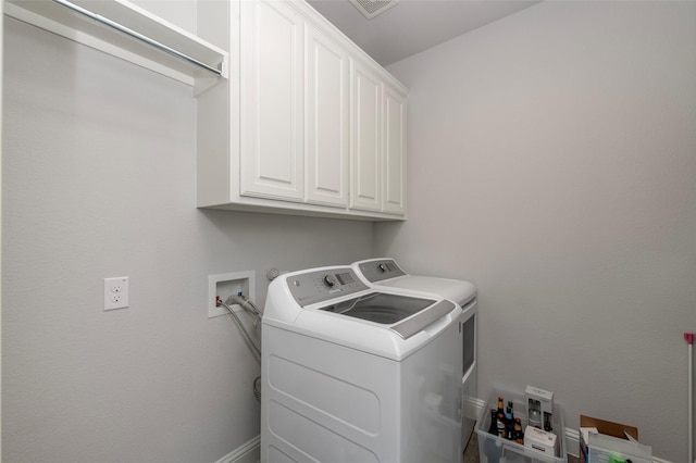 505 Proud Knight Ln, Lewisville, TX 75056 - laundry area with cabinet space and washer and dryer