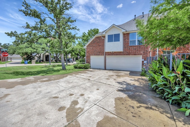700 Paradise Cv, Shady Shores, TX 76208 - view of front of house with a garage, brick siding, concrete driveway, a front lawn, and a shingled roof