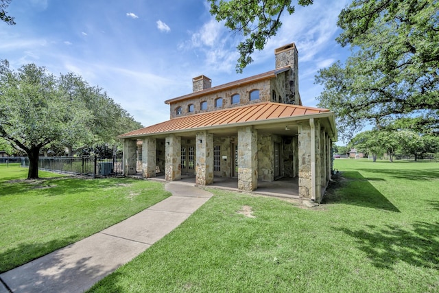700 Paradise Cv, Shady Shores, TX 76208 - view of front of property with a chimney, a standing seam roof, french doors, and stone siding