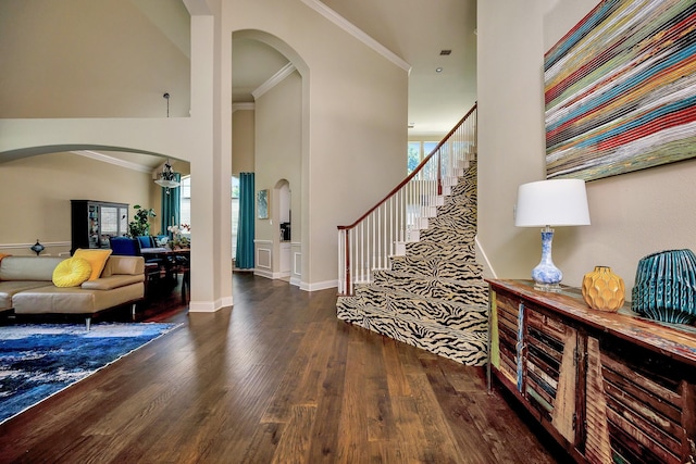 700 Paradise Cv, Shady Shores, TX 76208 - foyer featuring arched walkways, wood finished floors, stairs, crown molding, and a high ceiling